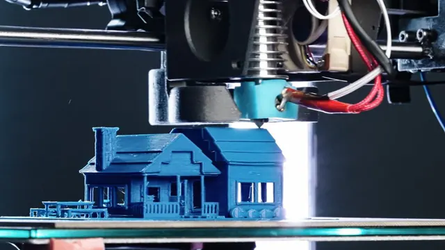 Small building model being made on a 3D-printer bed